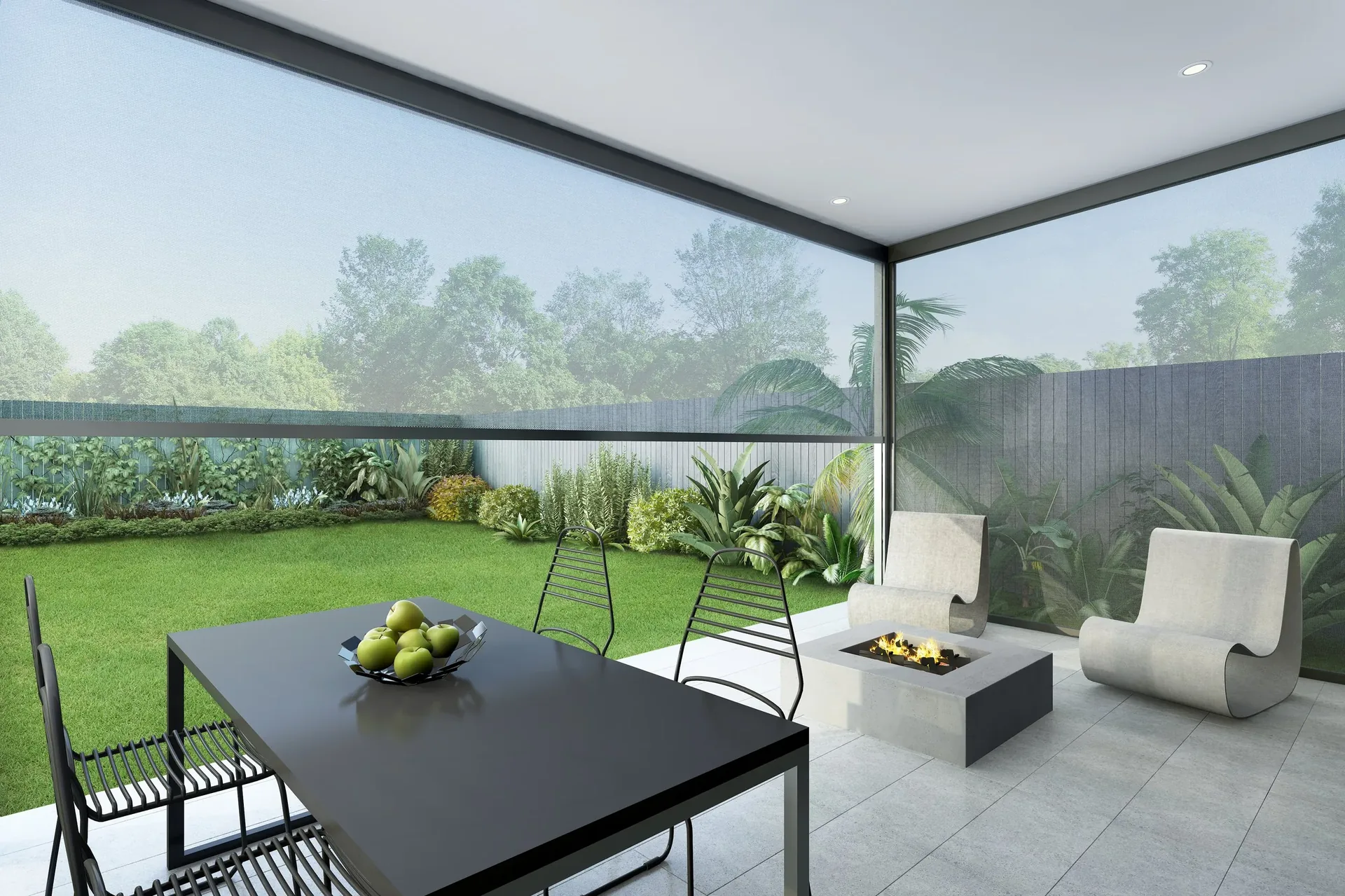 Zipscreen outdoor blinds enclosing a covered alfresco area beside a lawn