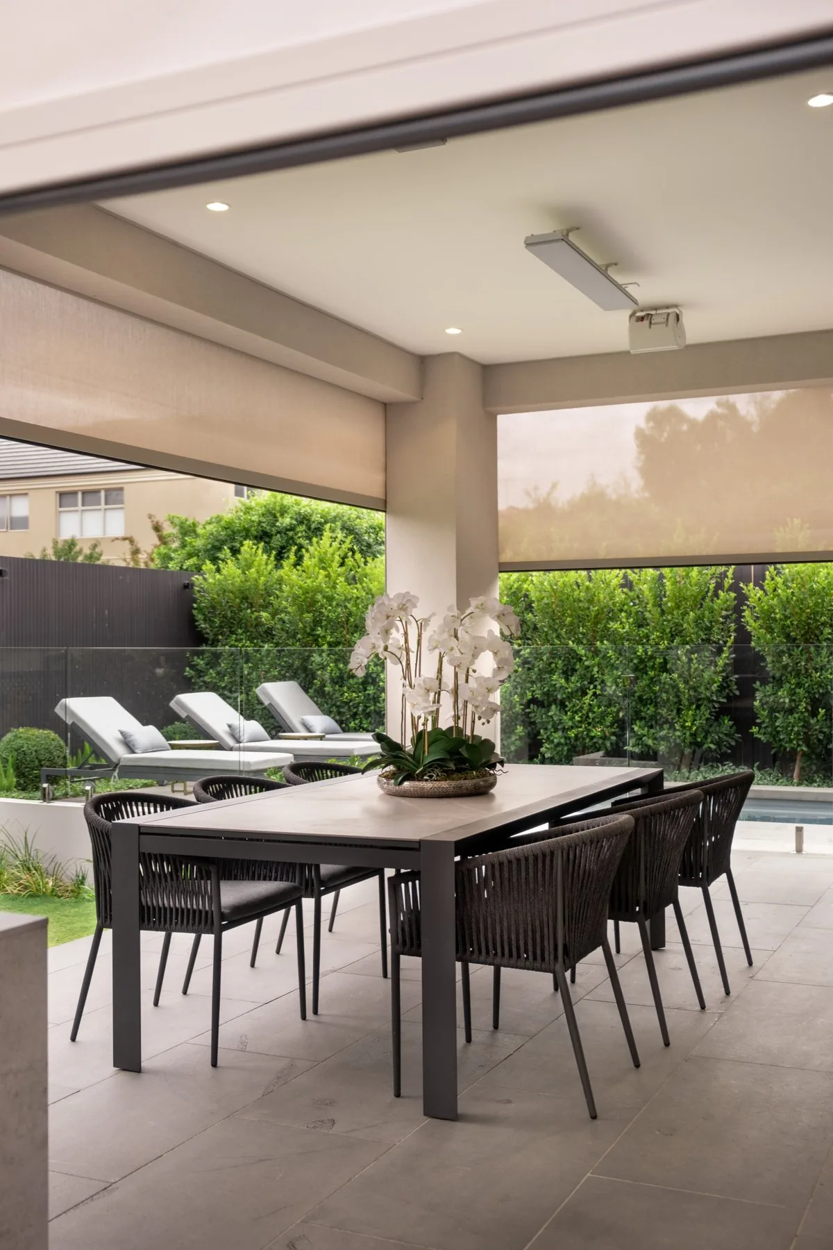 Zipscreen outdoor blinds lowered around an alfresco dining area